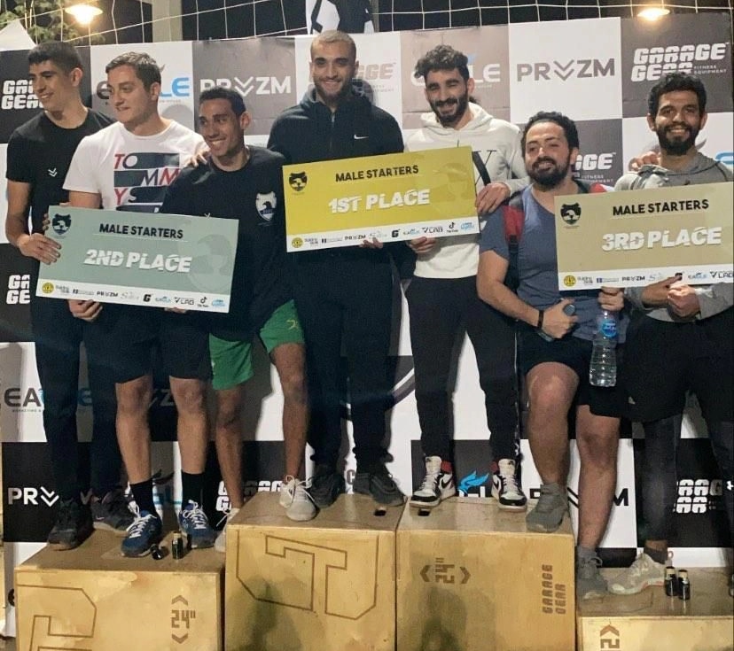 Ramez Asaad on the podium holding the first-place sign at the Egyptian Functional Fitness League