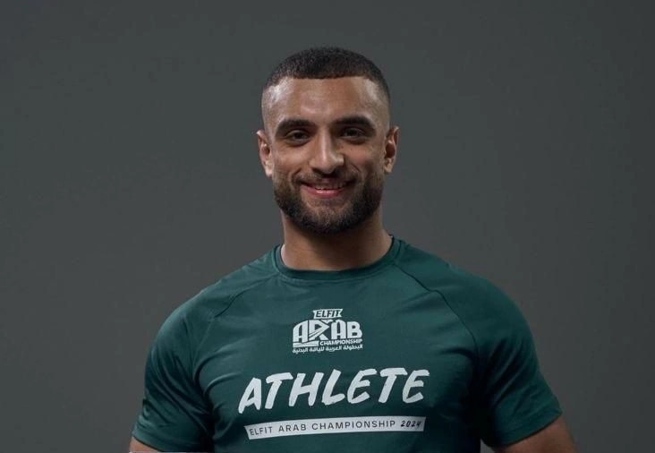 Smiling portrait of Ramez Asaad in his ELFIT Arab Championship 2024 athlete shirt