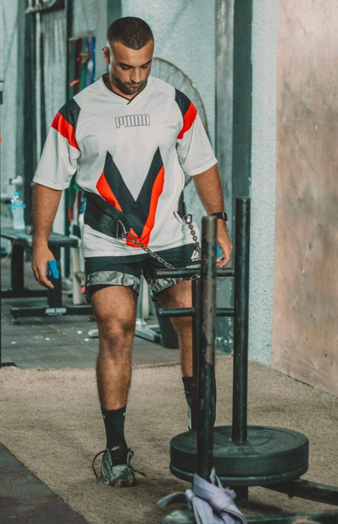 Ramez Asaad pulling a loaded sled with a harness