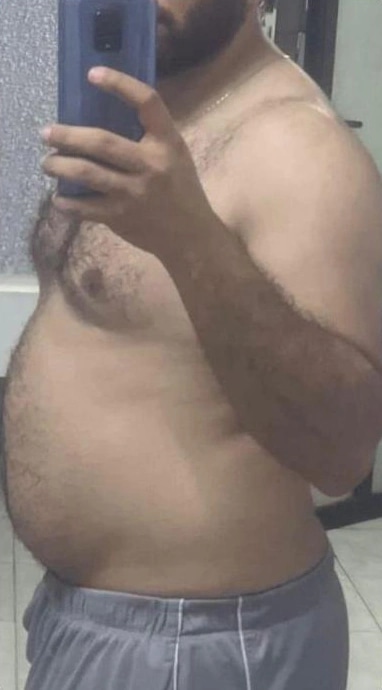 Client before coaching, side view in a mirror at 86.6 kg