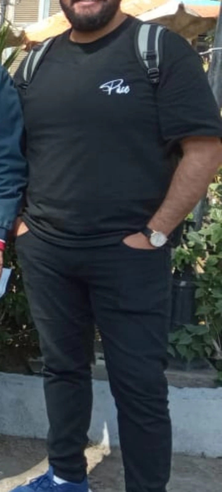 Client before coaching, at 104 kg, in a black t-shirt and jeans